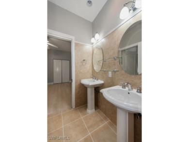 This STUNNING home in the highly sought-after Gateway community on Gateway Golf and Country Club in Florida - for sale on GolfHomes.com, golf home, golf lot