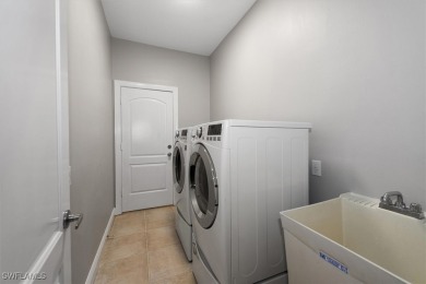 This STUNNING home in the highly sought-after Gateway community on Gateway Golf and Country Club in Florida - for sale on GolfHomes.com, golf home, golf lot