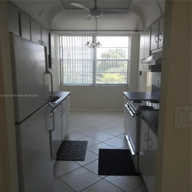 Lovely Corner Unit 2 bedrooms & 2 full baths with amazing and on Pembroke Lakes Golf Club in Florida - for sale on GolfHomes.com, golf home, golf lot