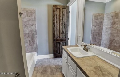 Welcome Home! Step into this meticulously maintained residence on Reunion Golf Club in Mississippi - for sale on GolfHomes.com, golf home, golf lot