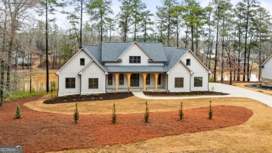 Relax and gaze upon the peaceful water view of this interior on Harbor Club Golf and Country Club in Georgia - for sale on GolfHomes.com, golf home, golf lot