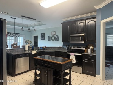 Nestled near the scenic Hickory Hills Golf Course, this charming on Mississippi National Golf Course in Mississippi - for sale on GolfHomes.com, golf home, golf lot