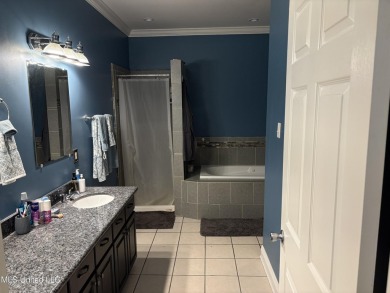 Nestled near the scenic Hickory Hills Golf Course, this charming on Mississippi National Golf Course in Mississippi - for sale on GolfHomes.com, golf home, golf lot
