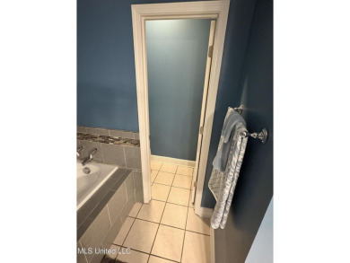 Nestled near the scenic Hickory Hills Golf Course, this charming on Mississippi National Golf Course in Mississippi - for sale on GolfHomes.com, golf home, golf lot