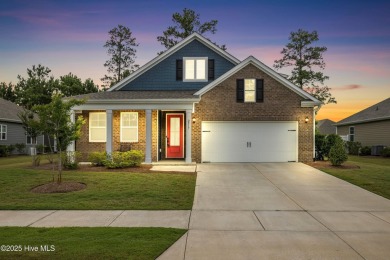Welcome to a home where timeless elegance meets modern ease--The on Cape Fear National At Brunswick Forest in North Carolina - for sale on GolfHomes.com, golf home, golf lot