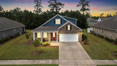Welcome to a home where timeless elegance meets modern ease--The on Cape Fear National At Brunswick Forest in North Carolina - for sale on GolfHomes.com, golf home, golf lot