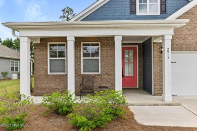 Welcome to a home where timeless elegance meets modern ease--The on Cape Fear National At Brunswick Forest in North Carolina - for sale on GolfHomes.com, golf home, golf lot
