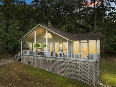 Welcome to your turn-key retreat in the heart of East Texas! on Holly Lake Ranch Golf Club in Texas - for sale on GolfHomes.com, golf home, golf lot