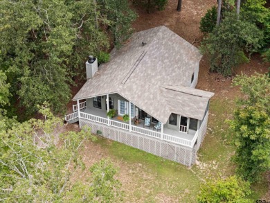Welcome to your turn-key retreat in the heart of East Texas! on Holly Lake Ranch Golf Club in Texas - for sale on GolfHomes.com, golf home, golf lot