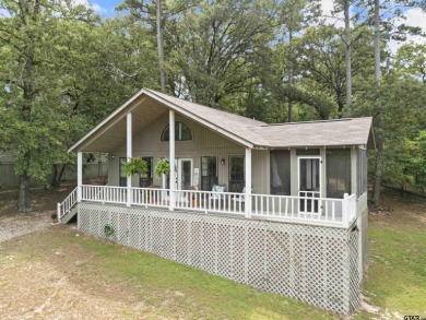 Welcome to your turn-key retreat in the heart of East Texas! on Holly Lake Ranch Golf Club in Texas - for sale on GolfHomes.com, golf home, golf lot