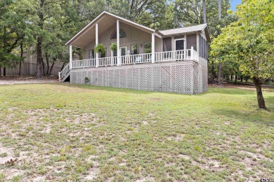 Welcome to your turn-key retreat in the heart of East Texas! on Holly Lake Ranch Golf Club in Texas - for sale on GolfHomes.com, golf home, golf lot