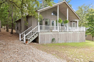 Welcome to your turn-key retreat in the heart of East Texas! on Holly Lake Ranch Golf Club in Texas - for sale on GolfHomes.com, golf home, golf lot