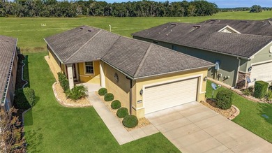 Priceless meadow views set the tone for this beautifully on Stone Creek Golf Club in Florida - for sale on GolfHomes.com, golf home, golf lot