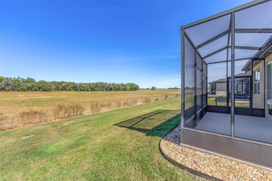 Priceless meadow views set the tone for this beautifully on Stone Creek Golf Club in Florida - for sale on GolfHomes.com, golf home, golf lot