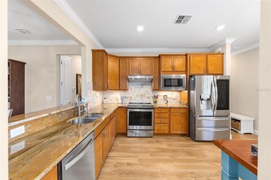 Priceless meadow views set the tone for this beautifully on Stone Creek Golf Club in Florida - for sale on GolfHomes.com, golf home, golf lot