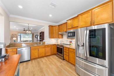 Priceless meadow views set the tone for this beautifully on Stone Creek Golf Club in Florida - for sale on GolfHomes.com, golf home, golf lot