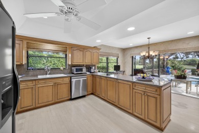 A beautiful Courtyard entrance and amazing 5 acre lake/golf on  in Florida - for sale on GolfHomes.com, golf home, golf lot