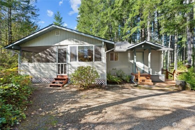 Welcome Home! This price includes a secluded double lot on Lake Cushman Golf Course in Washington - for sale on GolfHomes.com, golf home, golf lot