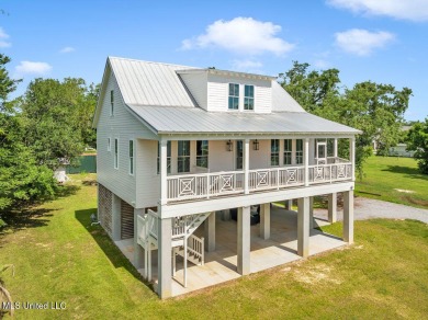Beautiful home with gorgeous views of the Bay of Saint Louis! on The Bridges Golf Club At Hollywood Casino in Mississippi - for sale on GolfHomes.com, golf home, golf lot