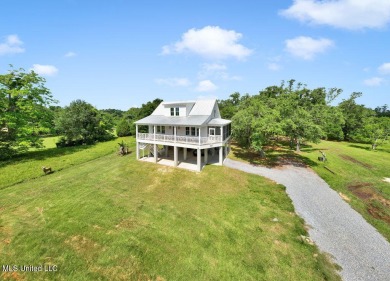 Beautiful home with gorgeous views of the Bay of Saint Louis! on The Bridges Golf Club At Hollywood Casino in Mississippi - for sale on GolfHomes.com, golf home, golf lot