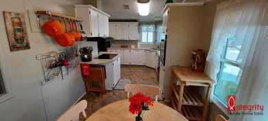 Come settle down and relax in a beautiful manufactured home with on Fairways Country Club in Florida - for sale on GolfHomes.com, golf home, golf lot