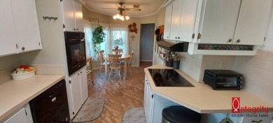 Come settle down and relax in a beautiful manufactured home with on Fairways Country Club in Florida - for sale on GolfHomes.com, golf home, golf lot