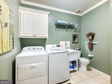 Nestled in the prestigious Windermere community, this on Windermere Golf Club in Georgia - for sale on GolfHomes.com, golf home, golf lot