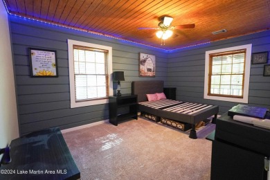 This 3 bedroom, 2 bath one level log home sits on a large flat on Stillwaters Golf and Country Club in Alabama - for sale on GolfHomes.com, golf home, golf lot