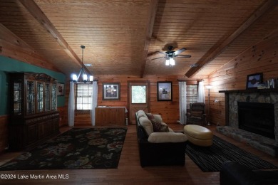 This 3 bedroom, 2 bath one level log home sits on a large flat on Stillwaters Golf and Country Club in Alabama - for sale on GolfHomes.com, golf home, golf lot