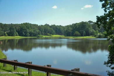 This 3 bedroom, 2 bath one level log home sits on a large flat on Stillwaters Golf and Country Club in Alabama - for sale on GolfHomes.com, golf home, golf lot