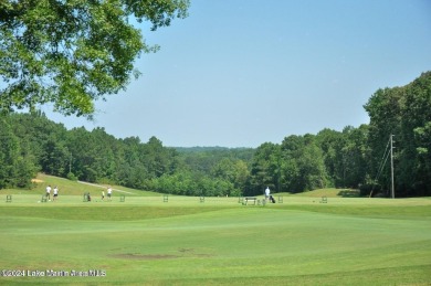 This 3 bedroom, 2 bath one level log home sits on a large flat on Stillwaters Golf and Country Club in Alabama - for sale on GolfHomes.com, golf home, golf lot