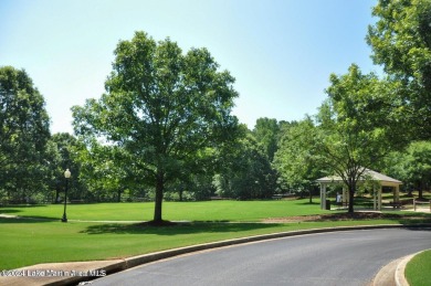 This 3 bedroom, 2 bath one level log home sits on a large flat on Stillwaters Golf and Country Club in Alabama - for sale on GolfHomes.com, golf home, golf lot