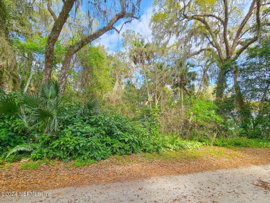 Build your dream home!!  This beautiful wooded lot is located in on Palm Harbor Golf Club in Florida - for sale on GolfHomes.com, golf home, golf lot
