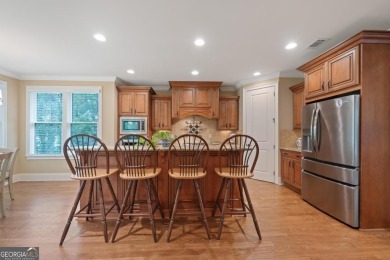 Discover elevated golf living in this exquisite golf home on Reynolds Lake Oconee - The Oconee in Georgia - for sale on GolfHomes.com, golf home, golf lot