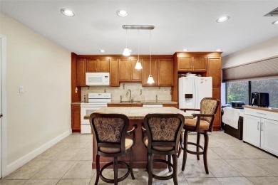 Rarely available corner unit located in the desired community of on Jacaranda Golf Club in Florida - for sale on GolfHomes.com, golf home, golf lot