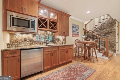 Discover elevated golf living in this exquisite golf home on Reynolds Lake Oconee - The Oconee in Georgia - for sale on GolfHomes.com, golf home, golf lot