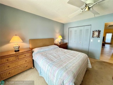 WATERVIEW! FIRST FLOOR, TWO BEDROOM, TWO FULL BATH HOME WITH A on Hillsboro Pines Golf in Florida - for sale on GolfHomes.com, golf home, golf lot