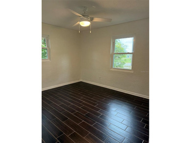 Beautiful, updated 2-bedroom, 1-bath home situated on nearly a on Clearwater Executive Golf Course in Florida - for sale on GolfHomes.com, golf home, golf lot