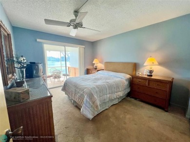 WATERVIEW! FIRST FLOOR, TWO BEDROOM, TWO FULL BATH HOME WITH A on Hillsboro Pines Golf in Florida - for sale on GolfHomes.com, golf home, golf lot