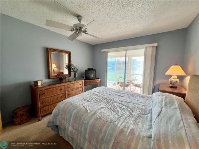 WATERVIEW! FIRST FLOOR, TWO BEDROOM, TWO FULL BATH HOME WITH A on Hillsboro Pines Golf in Florida - for sale on GolfHomes.com, golf home, golf lot
