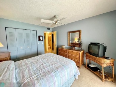 WATERVIEW! FIRST FLOOR, TWO BEDROOM, TWO FULL BATH HOME WITH A on Hillsboro Pines Golf in Florida - for sale on GolfHomes.com, golf home, golf lot