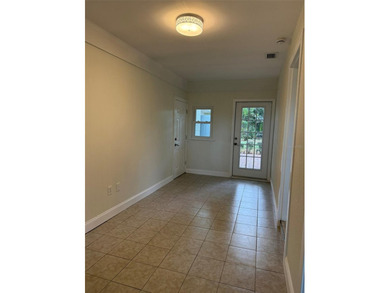 Beautiful, updated 2-bedroom, 1-bath home situated on nearly a on Clearwater Executive Golf Course in Florida - for sale on GolfHomes.com, golf home, golf lot