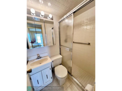 WATERVIEW! FIRST FLOOR, TWO BEDROOM, TWO FULL BATH HOME WITH A on Hillsboro Pines Golf in Florida - for sale on GolfHomes.com, golf home, golf lot