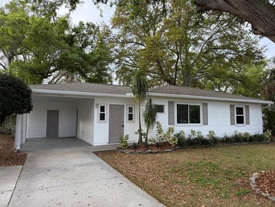 Beautiful, updated 2-bedroom, 1-bath home situated on nearly a on Clearwater Executive Golf Course in Florida - for sale on GolfHomes.com, golf home, golf lot