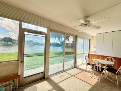 WATERVIEW! FIRST FLOOR, TWO BEDROOM, TWO FULL BATH HOME WITH A on Hillsboro Pines Golf in Florida - for sale on GolfHomes.com, golf home, golf lot