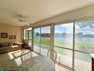 WATERVIEW! FIRST FLOOR, TWO BEDROOM, TWO FULL BATH HOME WITH A on Hillsboro Pines Golf in Florida - for sale on GolfHomes.com, golf home, golf lot