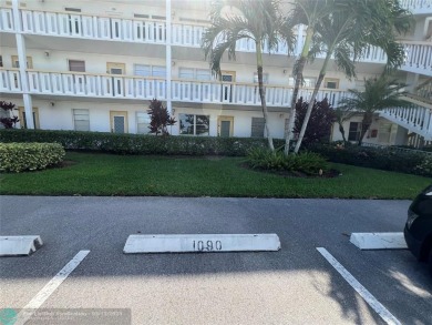 WATERVIEW! FIRST FLOOR, TWO BEDROOM, TWO FULL BATH HOME WITH A on Hillsboro Pines Golf in Florida - for sale on GolfHomes.com, golf home, golf lot
