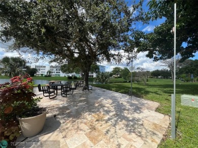 WATERVIEW! FIRST FLOOR, TWO BEDROOM, TWO FULL BATH HOME WITH A on Hillsboro Pines Golf in Florida - for sale on GolfHomes.com, golf home, golf lot