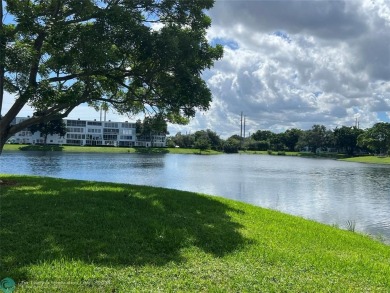 WATERVIEW! FIRST FLOOR, TWO BEDROOM, TWO FULL BATH HOME WITH A on Hillsboro Pines Golf in Florida - for sale on GolfHomes.com, golf home, golf lot