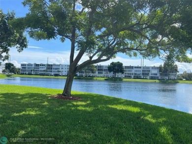 WATERVIEW! FIRST FLOOR, TWO BEDROOM, TWO FULL BATH HOME WITH A on Hillsboro Pines Golf in Florida - for sale on GolfHomes.com, golf home, golf lot